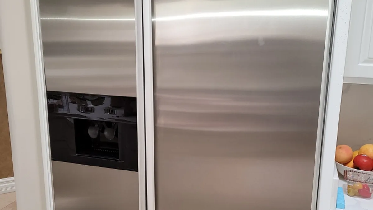 Factory-certified appliance repair technician servicing luxury refrigeration, laundry suites, and cooking ranges in Redwood City, CA